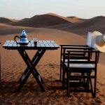 tea served by the dunes at azalai camp