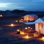erg chigaga luxury camp by sunset