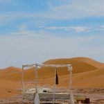 sahara luxury camp with 4 poster bed by the dunes