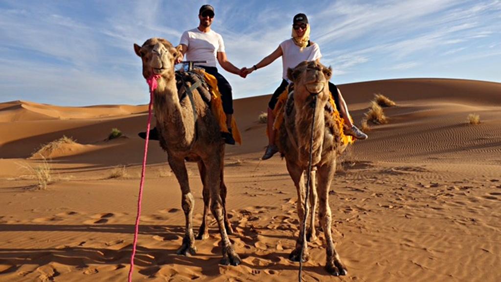 Morocco honeymoon couple on camels