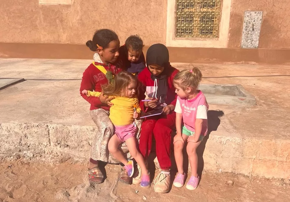 Morocco with children on a tour playing with local kids
