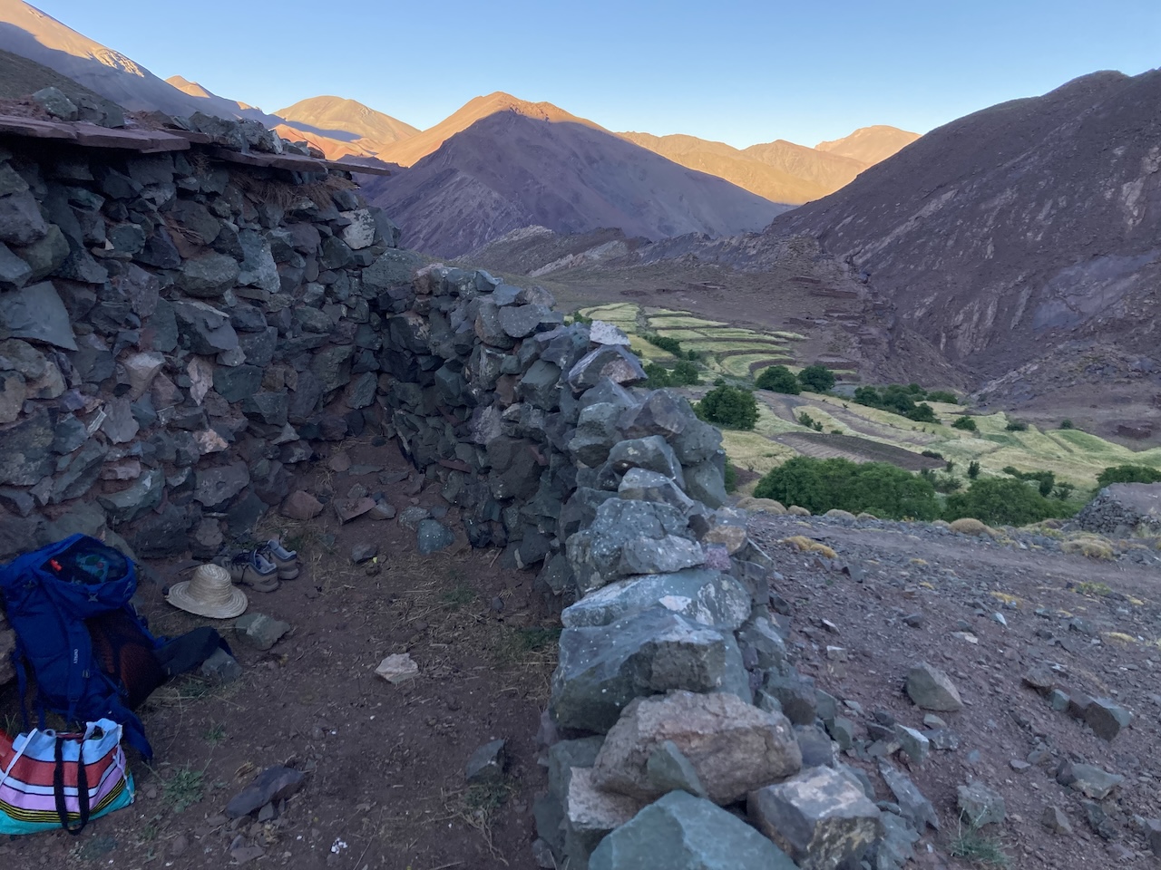 A summer trek over streams and waterfalls 4 a person sitting in a stone wall